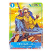 A character trading card featuring Trafalgar Law from the anime One Piece, with a yellow and blue outfit, holding a sword against a bright orange and yellow background. The card has Japanese text and a blue '1' health icon in the top left corner.