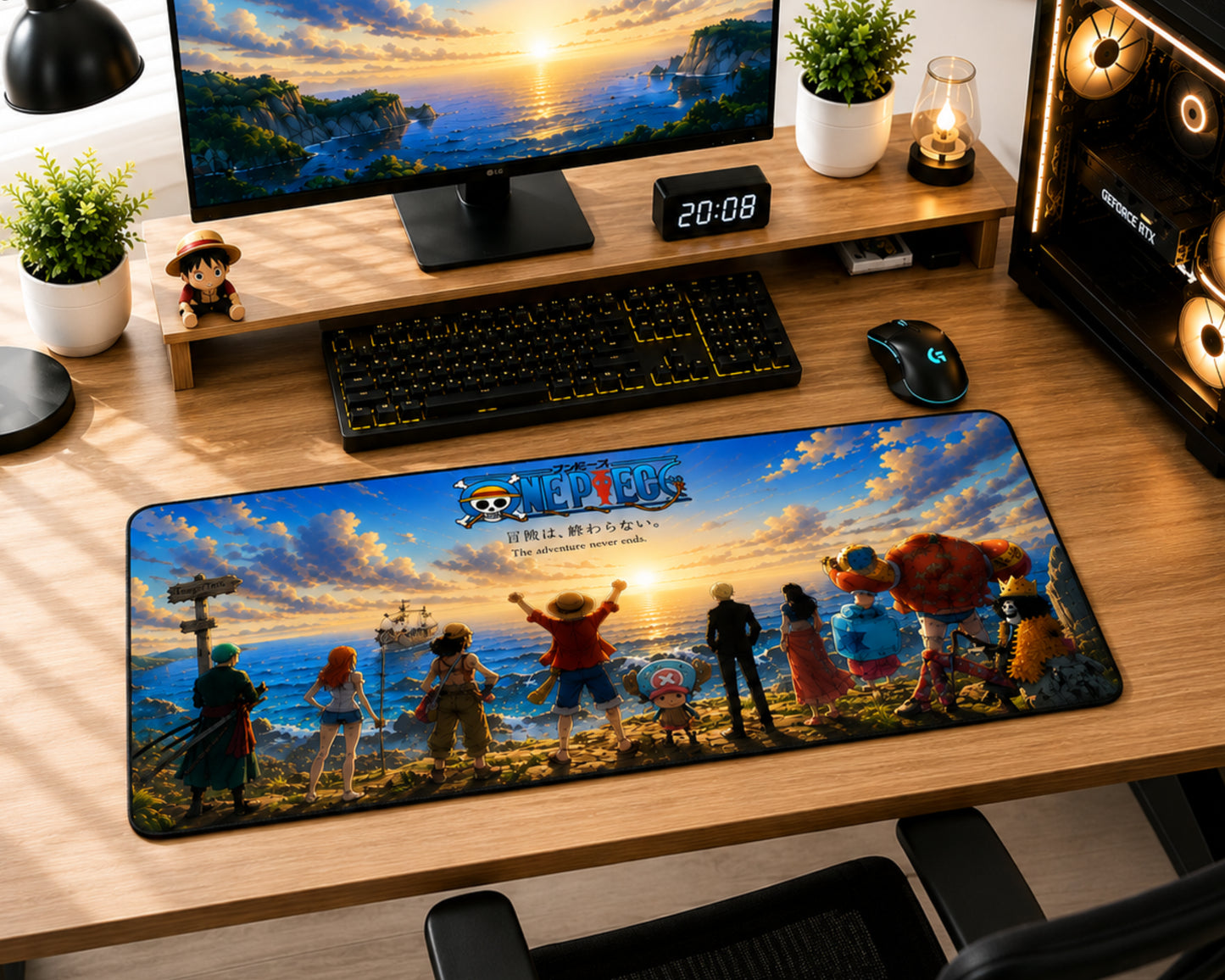 A large desk mat featuring characters and artwork from One Piece: Pirate Bay, displayed on a wooden desk in a gaming setup alongside a keyboard, mouse, monitor, and plants.