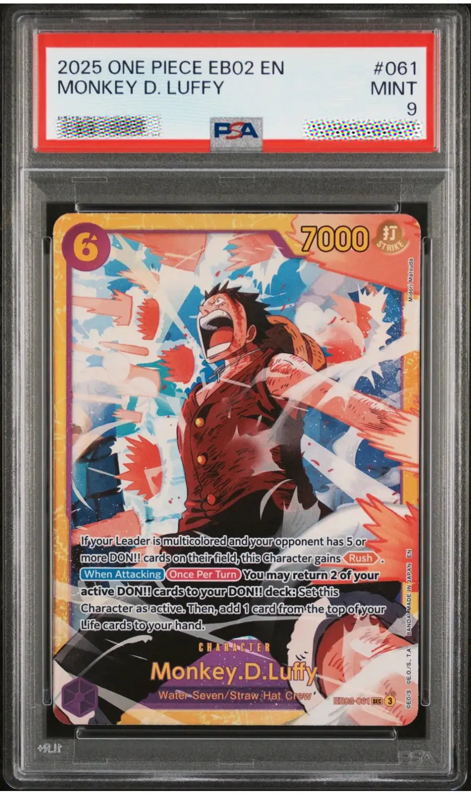 A graded One Piece trading card of Monkey D. Luffy, PSA graded 9, sealed in a clear protective plastic holder.