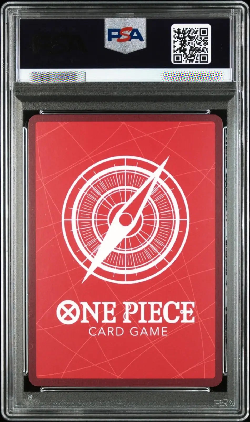  deck in a clear plastic holder, featuring a red card back with a white compass design and the text 'ONE PIECE CARD GAME'. The PSA logo and QR code are visible on the grading slab.