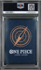 A PSA graded One Piece Card Game deck box inside a clear plastic grading case, featuring a dark blue box with a gold compass design and white One Piece branding.