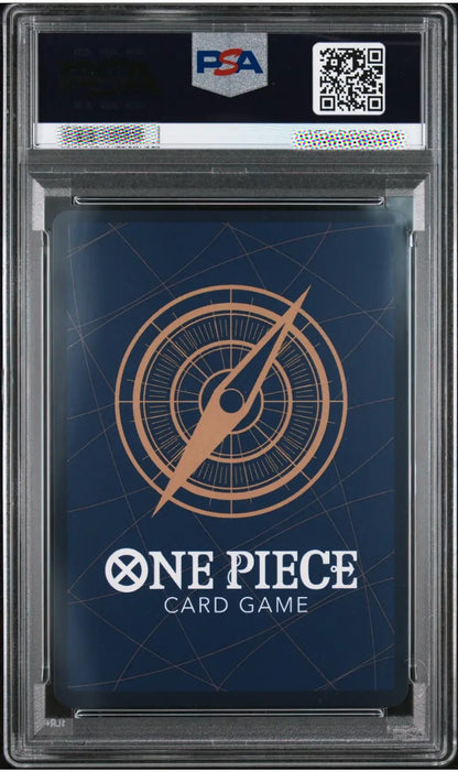 A PSA graded One Piece Card Game deck box inside a clear plastic grading case, featuring a dark blue box with a gold compass design and white One Piece branding.