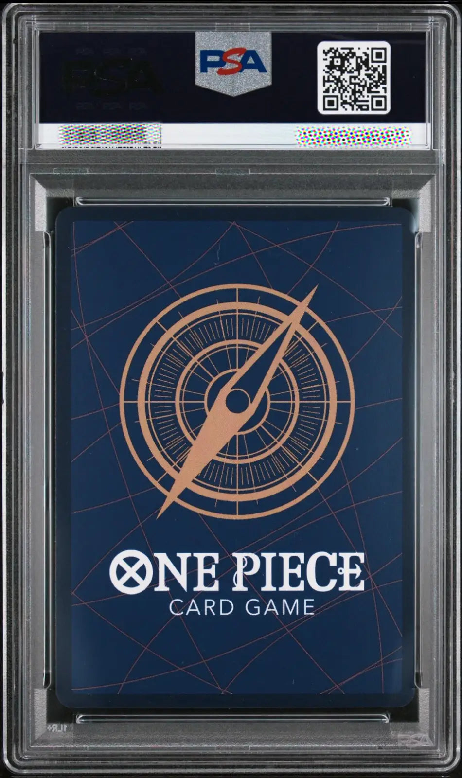A PSA graded One Piece Card Game deck box or card sleeve inside a clear plastic grading case, with a dark blue design and compass graphic.