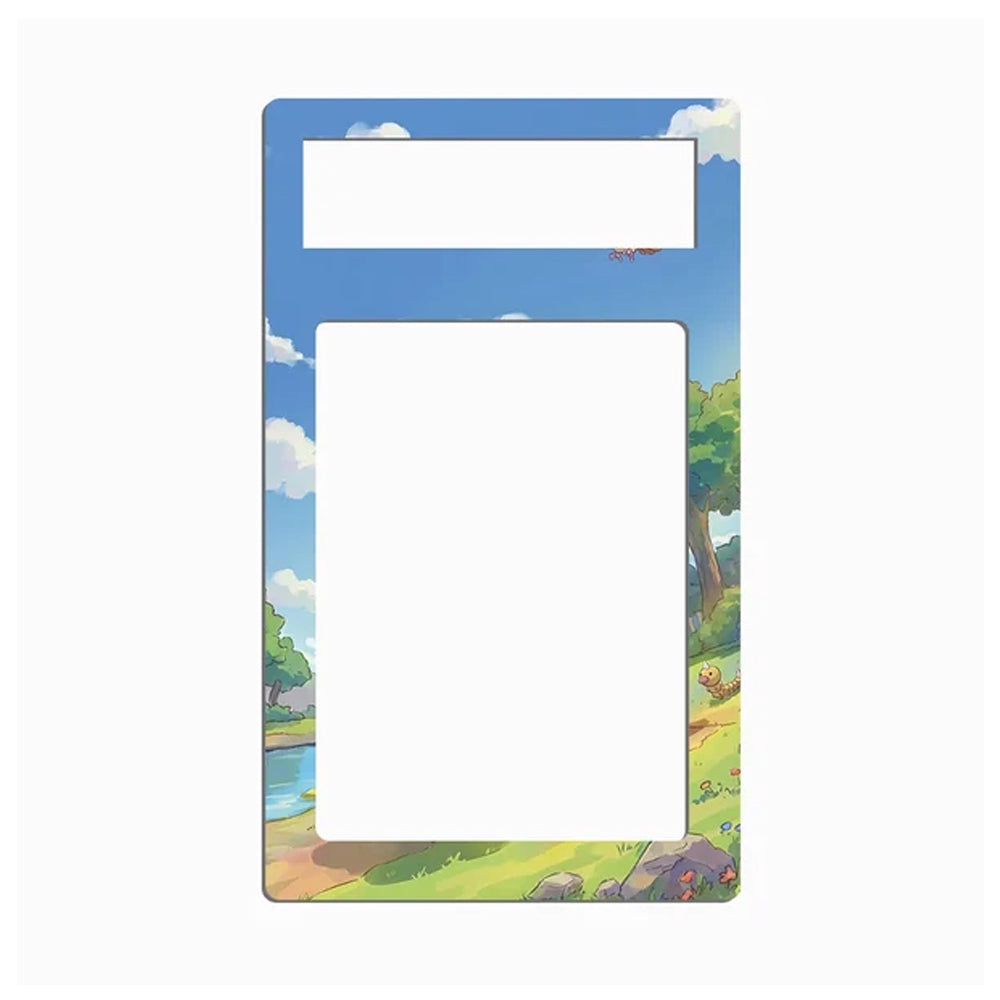 A landscape-themed picture frame with a blue sky and green grass border, featuring a large blank white center and a smaller blank white label area at the top.
