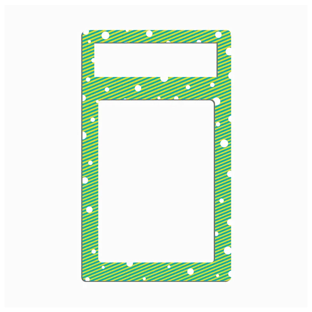 A rectangular green patterned frame or mat with rounded corners, featuring diagonal stripes, white dots, and a smaller horizontal cutout near the top, shown on a plain white background.