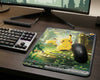Pikachu EX Pokémon style mouse pad displayed in a clean RGB gaming setup with mechanical keyboard, widescreen monitor, and wireless gaming mouse