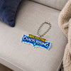 A Mega Evolution Phantasmal Flames keychain featuring a colorful neon-style acrylic charm with flame-shaped borders and a silver metal clasp and key ring, shown on a plain white background.