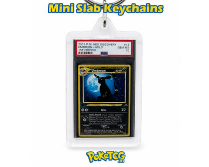 A clear acrylic keychain holder containing a graded holographic Umbreon Pokémon trading card, shown on a white background with 'Mini Slab Keychains' text at the top and a 'Pokémon' logo at the bottom.