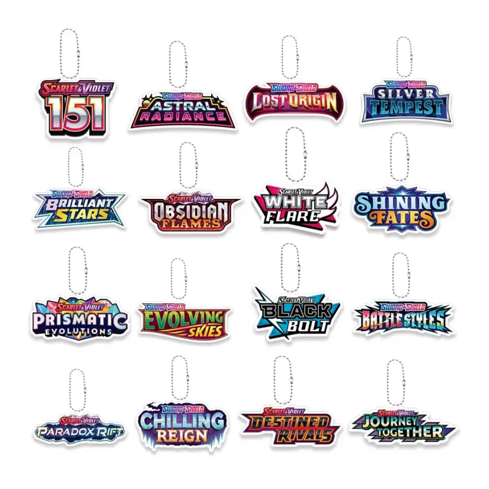 A set of 15 Magic: The Gathering sticker keychains arranged in a 3x5 grid on a plain white background. Each keychain features a colorful holographic logo representing a different hero expansion or set, complete with a silver metal key ring at the top.