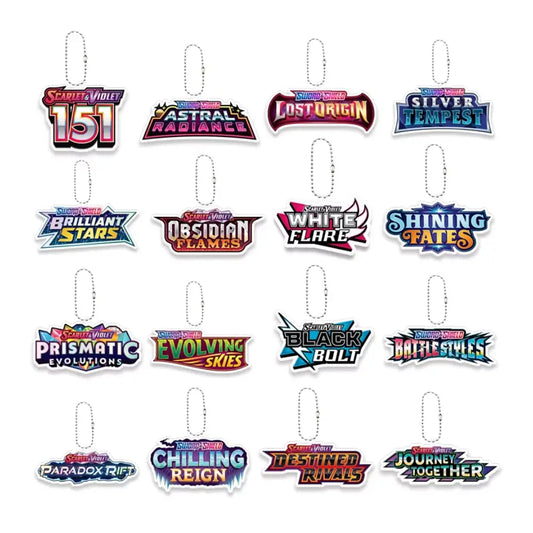 A set of 15 Magic: The Gathering sticker keychains arranged in a 3x5 grid on a plain white background. Each keychain features a colorful holographic logo representing a different hero expansion or set, complete with a silver metal key ring at the top.