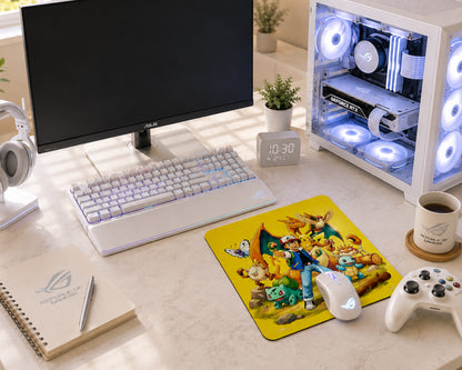 A styled desktop setup featuring a ASUS ROG gaming theme, including a white keyboard, mouse, headphones, controller, mug, notebook, and a custom RGB PC tower. A colorful cartoon mousepad with various characters is prominently displayed on the desk.