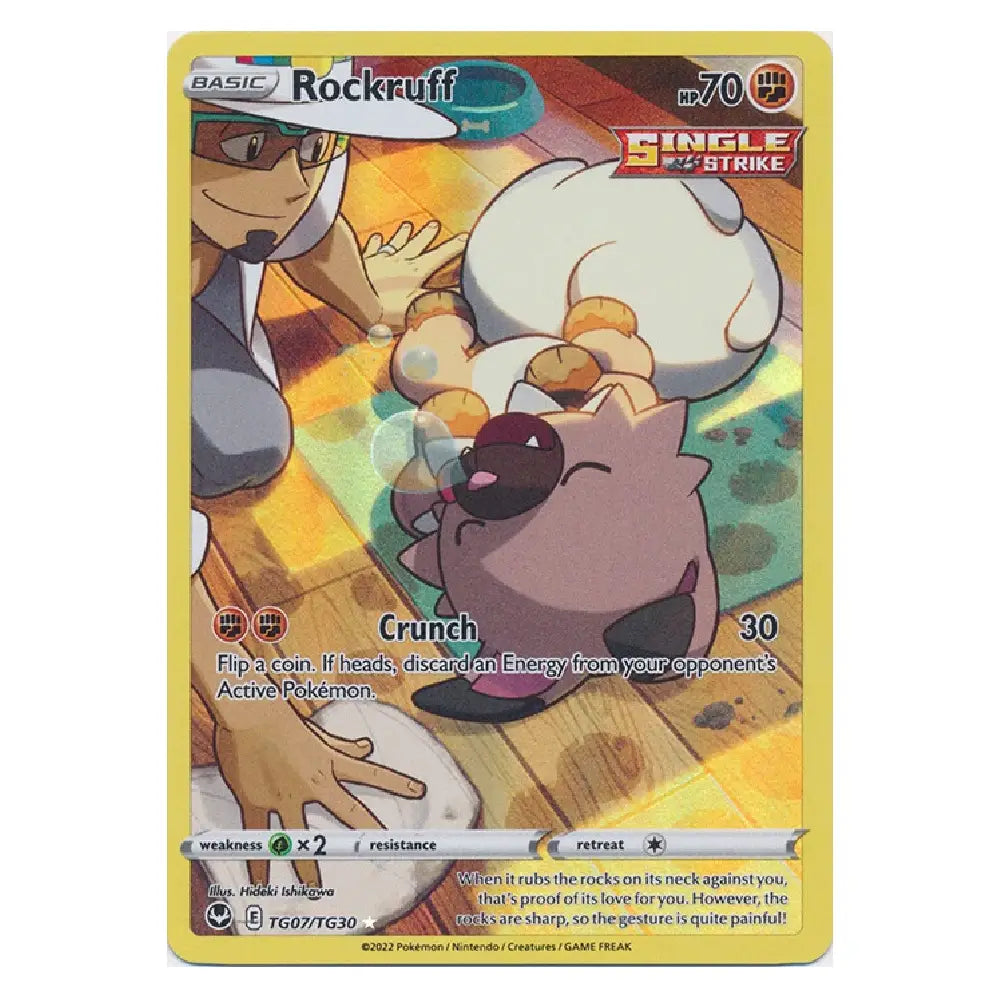 A single Pokémon trading card for Rockruff from the Basic set, featuring artwork of Rockruff rolling in a puddle with a trainer in the background. The card has a yellow border and is photographed against a plain white background.