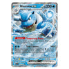 A holographic Pokémon trading card featuring Blastoise EX, a Stage 2 Water-type Pokémon. The card has a blue and silver design with artwork of Blastoise in an icy water environment, and text detailing its 'Tempurung Padat' and 'Twin Cannon' abilities.