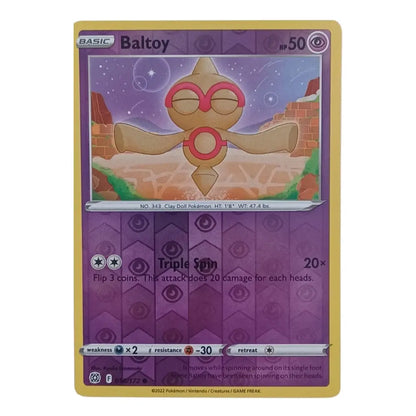A single Pokémon trading card for Baltoy from the Basic set, shown against a plain white background. The card features a purple and gold design with an illustration of the Baltoy character in the center.