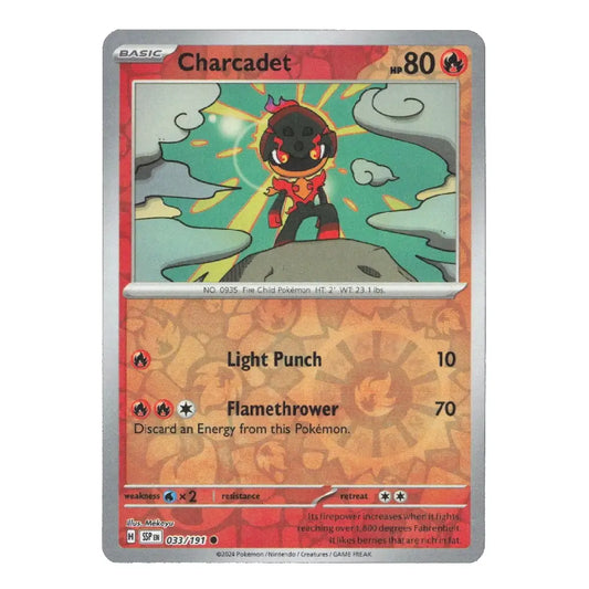 A Charcadet Pokémon trading card from the Basic set, featuring a red and orange design with an illustration of the character in the center.