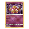 A single Pokémon trading card for Radiant Alakazam from the Basic Set, shown against a plain white background. The card has a gold border and features artwork of the Alakazam character in pink, purple, and gold tones.
