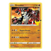 A Pokémon trading card for Groudon from the Basic set, featuring a yellow border, orange gradient background, and artwork of Groudon with a Pokémon badge on the right.