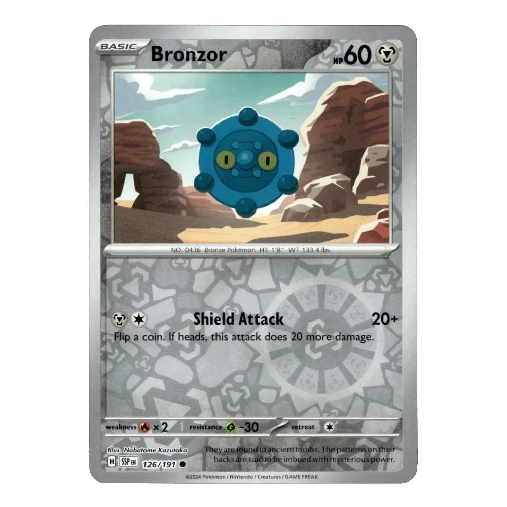 A single Pokémon trading card for Bronzor, shown against a plain white background. The card has a silver-gray border and features Bronzor in a blue creature frame above a desert canyon illustration.