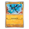 A single Pokémon trading card for Riolu from the Basic set, shown against a plain white background. The card features artwork of Riolu in blue and black, with a gold/yellow text box and silver border.