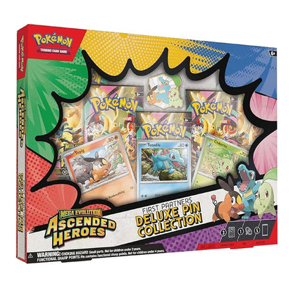 Pokémon Trading Card Game Mega Evolution Ascended Heroes First Partners Deluxe Pin Collection box set, featuring a colorful comic-style package design with a central pin display window showing assorted pins.