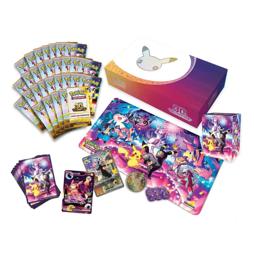 Pokémon TCG booster pack set and accessories displayed on a white background, including a colorful branded box, multiple booster packs, a large character playmat, a smaller playmat, a stack of cards, a coin, and a small accessory card.