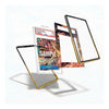 Three transparent phone case frames with black and gold borders are shown floating against a white background, with one frame holding a graded comic book insert and another showing a colorful printed insert design.