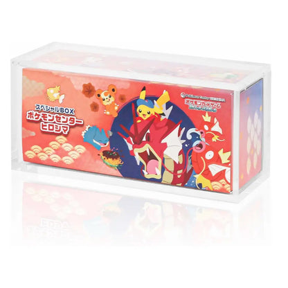 A clear plastic display box containing a red Pokémon-themed product package with Japanese text and illustrated characters, shown on a white background with a faint reflection.