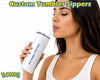 A woman drinking from a white customizable tumbler with a clear straw, shown against a white background with 'Custom Tumbler Sippers' text at the top and a PoketCG logo at the bottom left.