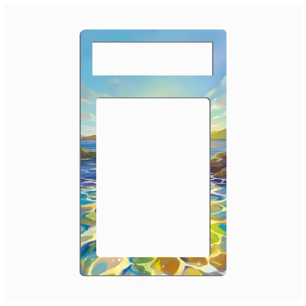 A rectangular picture frame with a colorful coastal landscape border. The top section is light blue, the bottom features a painted shoreline with blue water, yellow and green reflections, and distant hills, and the center is a blank white insert area.