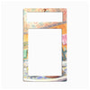 A decorative metal light switch plate cover featuring a colorful watercolor illustration of a cafe interior with geometric patterns, shown on a plain white background.