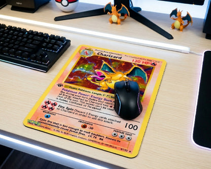 Retro Charizard Pokémon card themed gaming mouse pad displayed on a clean RGB gaming desk with mechanical keyboard and Charizard figurines