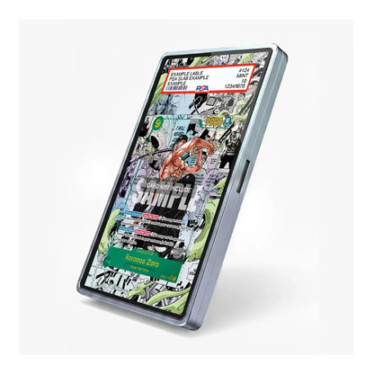 A slim, metallic silver rectangular device, likely a stylus or digital pen, shown at an angle on a light gray background. Its screen displays a colorful comic book cover with text including 'COMIC ZONE' and 'ANIME'.