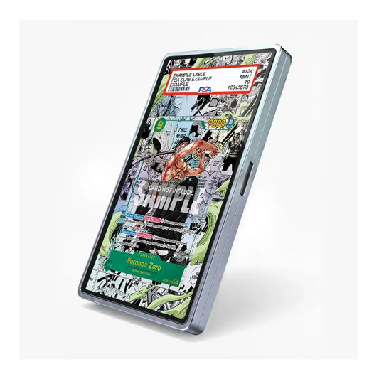 A slim, metallic silver rectangular device, likely a stylus or digital pen, shown at an angle on a light gray background. Its screen displays a colorful comic book cover with text including 'COMIC ZONE' and 'ANIME'.