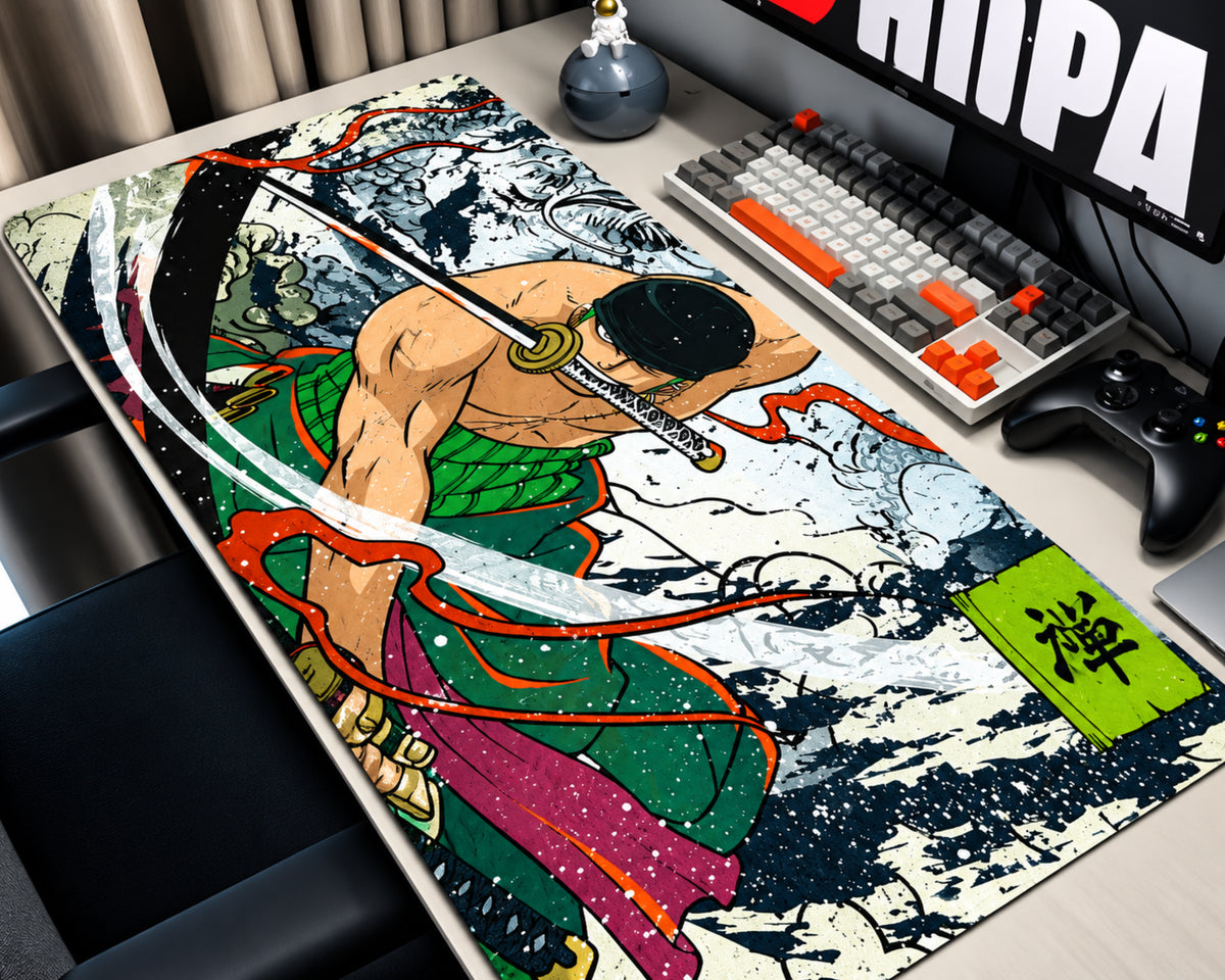 A large desk mat featuring a detailed anime-style samurai illustration, shown on a desk next to a keyboard, controller, and monitor in a home office setup.