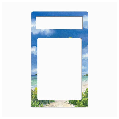 A rectangular picture frame with a tropical beach scene printed around the border. The top and bottom sections show a blue sky with white clouds, while the sides depict turquoise water and green beach foliage.
