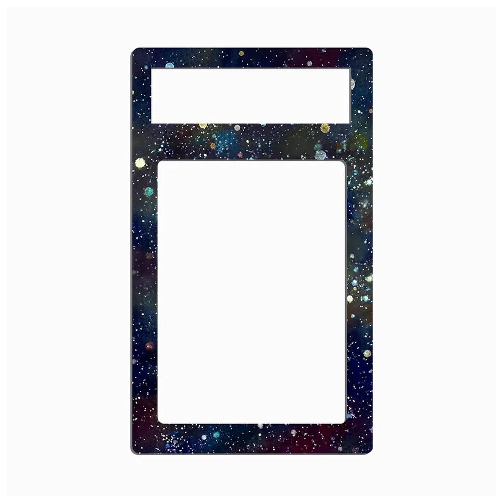 A decorative rectangular frame or plate with rounded corners, featuring a dark galaxy print with stars and colorful speckles. It has a smaller horizontal slot at the top and a larger vertical slot below, set against a plain white background.
