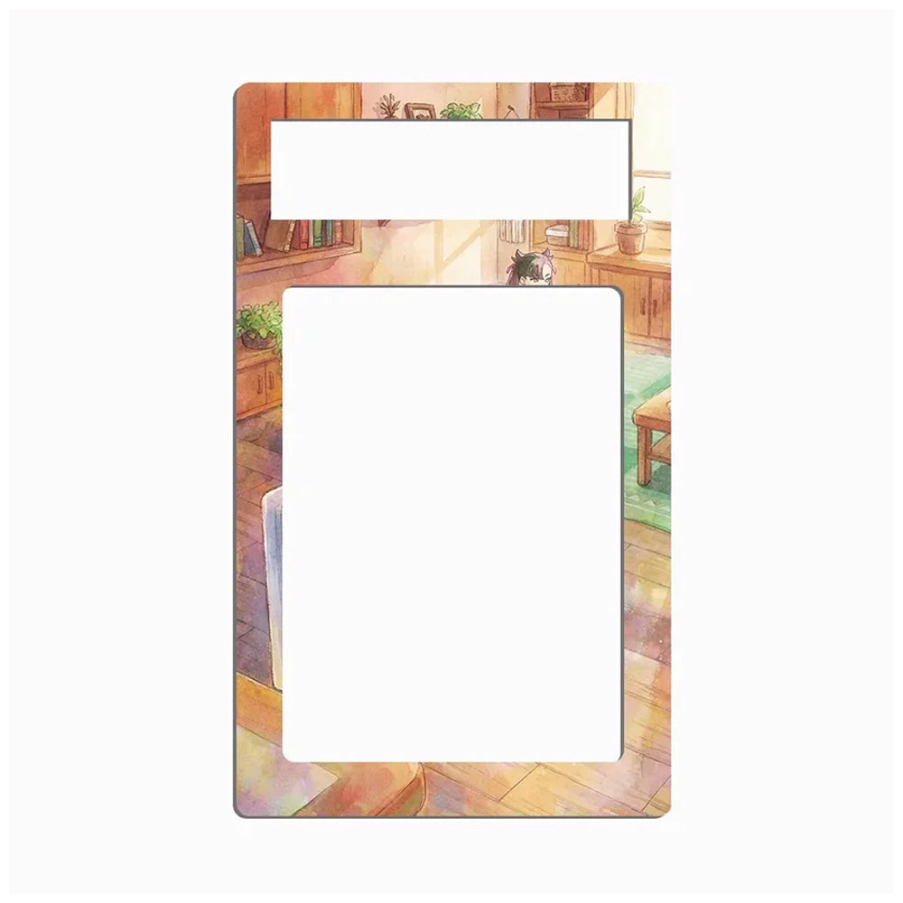 A decorative rectangular card or label with rounded corners, featuring a watercolor-style illustration of a cozy indoor room with wooden furniture, books, and a small cat peeking over a table. The center and top areas are blank white spaces, likely for writing or printing.