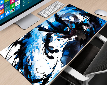 A large desk mat featuring a dynamic blue and black anime-style character design, shown on a light wood desk next to a computer monitor, keyboard, mouse, and chair.