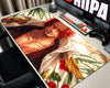 Shanks One Piece anime gaming mouse pad featuring red hair, a dark pirate outfit, golden feather details, and a tropical cream background.