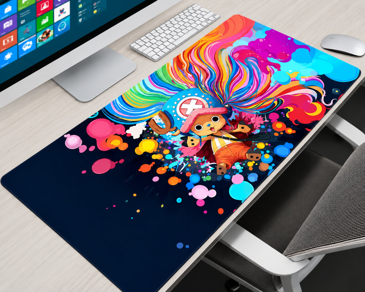 Tony Tony Chopper rainbow anime gaming mouse pad featuring Chopper in his blue hat with a white cross emblem, surrounded by colorful flowing patterns and pink, cyan, orange, yellow, and purple paint splashes on a navy background.