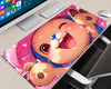 Tony Tony Chopper pink anime gaming mouse pad featuring a cute close-up illustration of Chopper wearing his blue hat, with peach-colored character artwork and pink decorative petals.