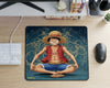 Top view of One Piece Luffy anime mouse pad featuring blueprint-style background on modern gaming desk with keyboard and mouse