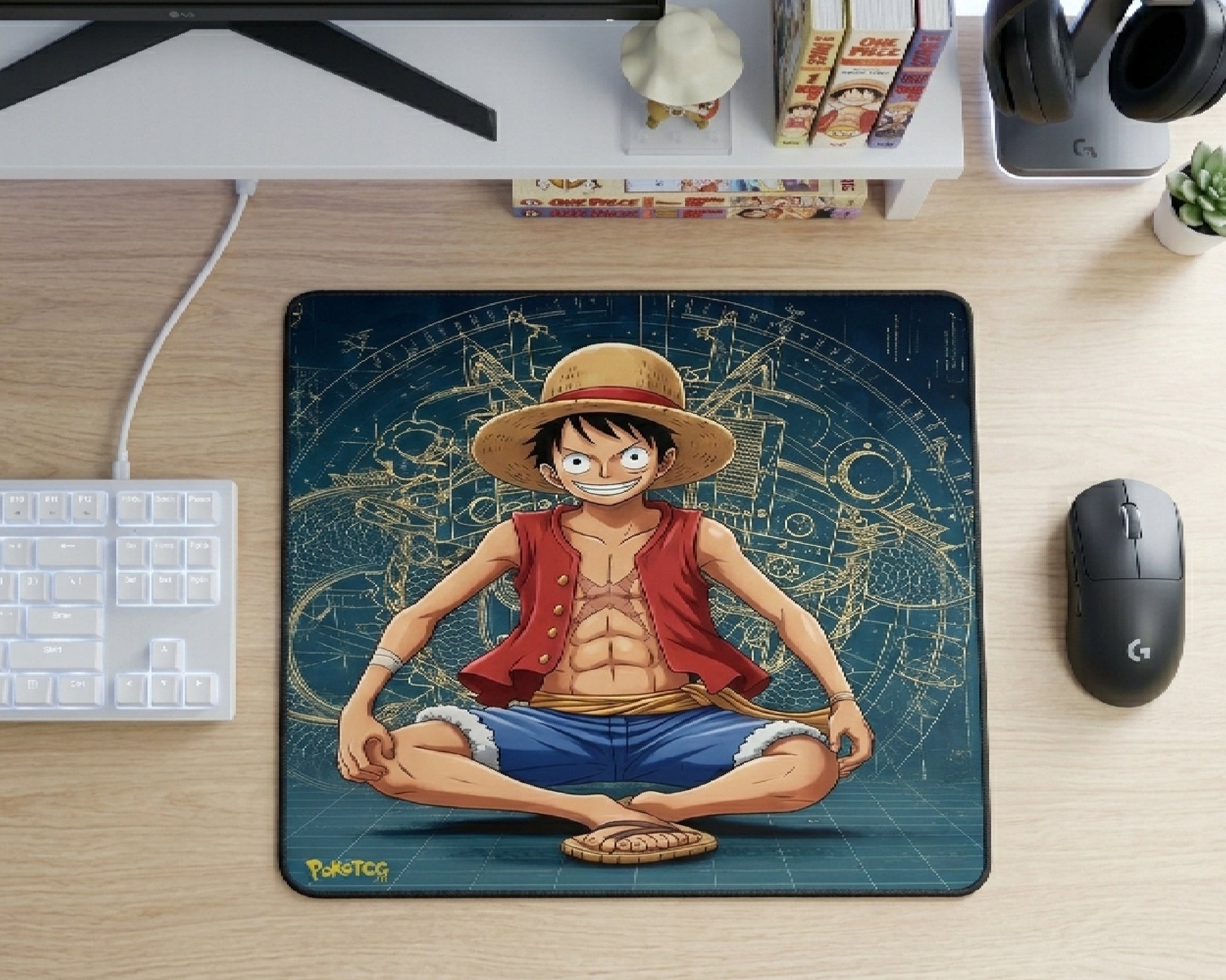 Top view of One Piece Luffy anime mouse pad featuring blueprint-style background on modern gaming desk with keyboard and mouse