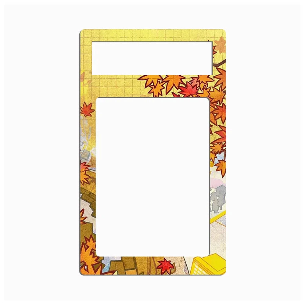A rectangular picture frame with rounded corners, featuring a yellow grid pattern on the top section and a border decorated with orange and red autumn maple leaves, yellow leaves, and small colorful illustrations on a light gray background.