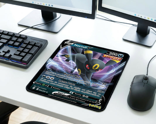 Noctali V Umbreon Pokémon card inspired mouse pad on a clean white gaming desk setup with RGB mechanical keyboard, dual monitors, and wireless mouse