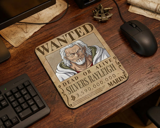 Vintage pirate themed workspace featuring a Silvers Rayleigh wanted poster mouse pad, wooden desktop, navigation map decor, and minimalist gaming mouse setup inspired by One Piece