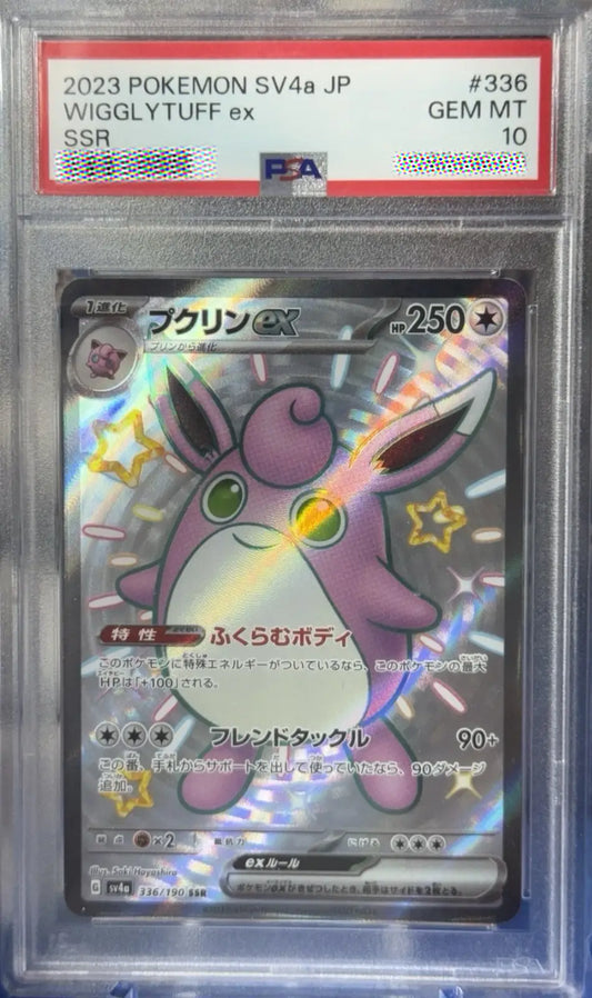 Pokémon trading card in a protective case with a label indicating its rarity and number.