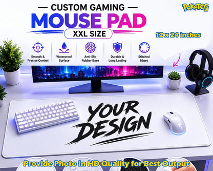 A large white gaming mouse pad displayed on a desk setup, with a keyboard, mouse, monitor, headphones, plants, and promotional text including 'CUSTOM GAMING MOUSE PAD', 'XXL SIZE', '12 x 24 inches', and 'YOUR DESIGN'.
