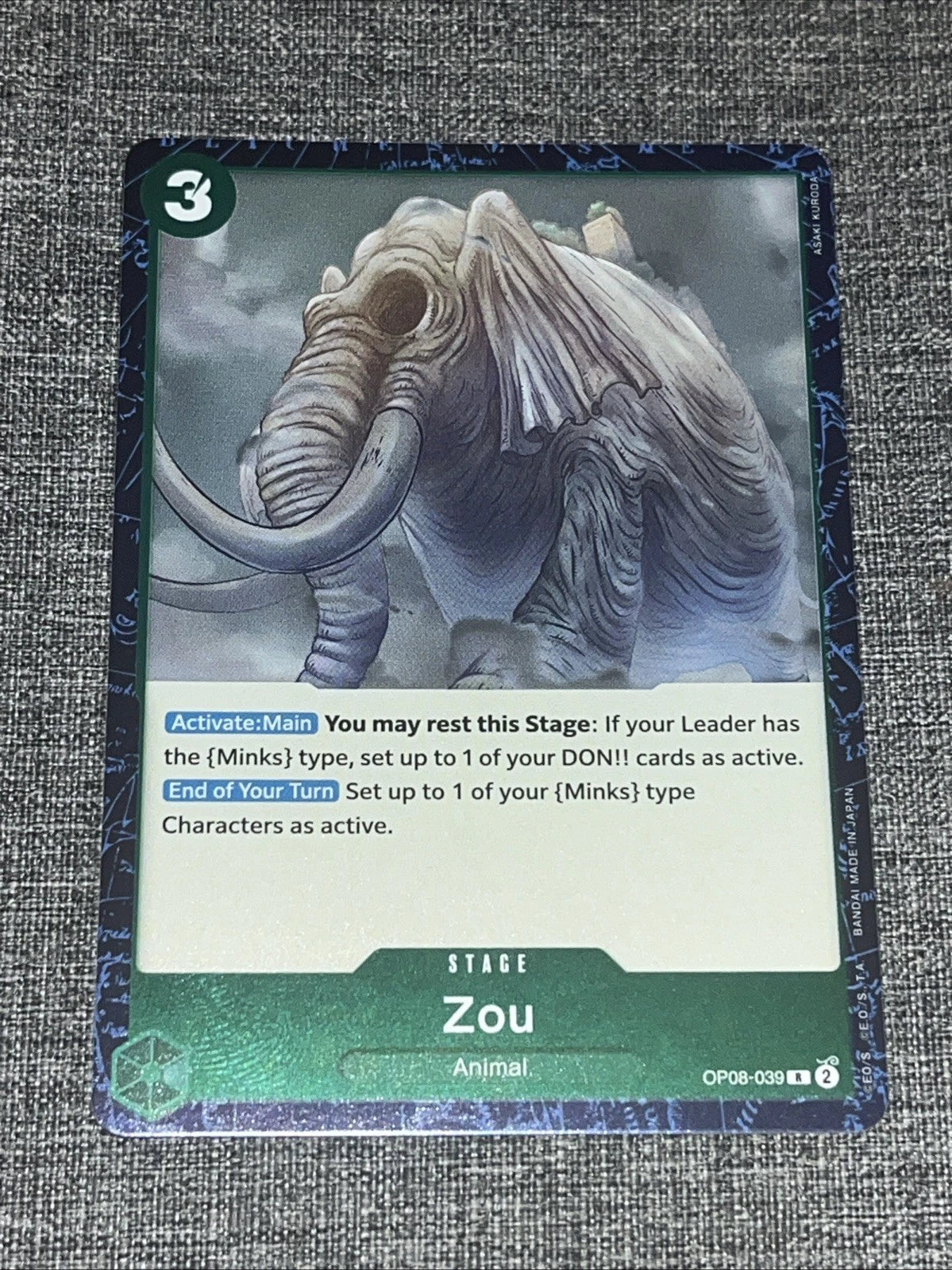 One Piece TCG Rare (R) Foil card of Zou from the Two Legends OP08 set, featuring the ancient elephant island in a stunning holographic finish.