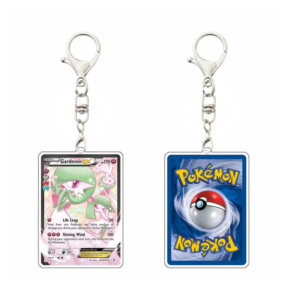 Two Pokémon acrylic keychains shown side by side on a white background. The left keychain features a Gardevoir EX card, and the right keychain features a blue Pokémon card with a Pokéball and the yellow Pokémon logo.